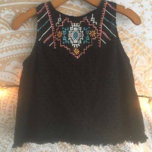 Black shirt, slightly cropped, with front design